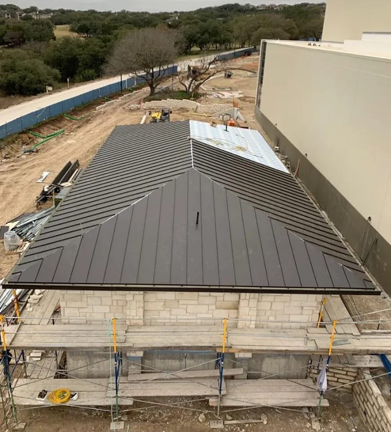 Metal roof new construction with scaffolding in Farmington